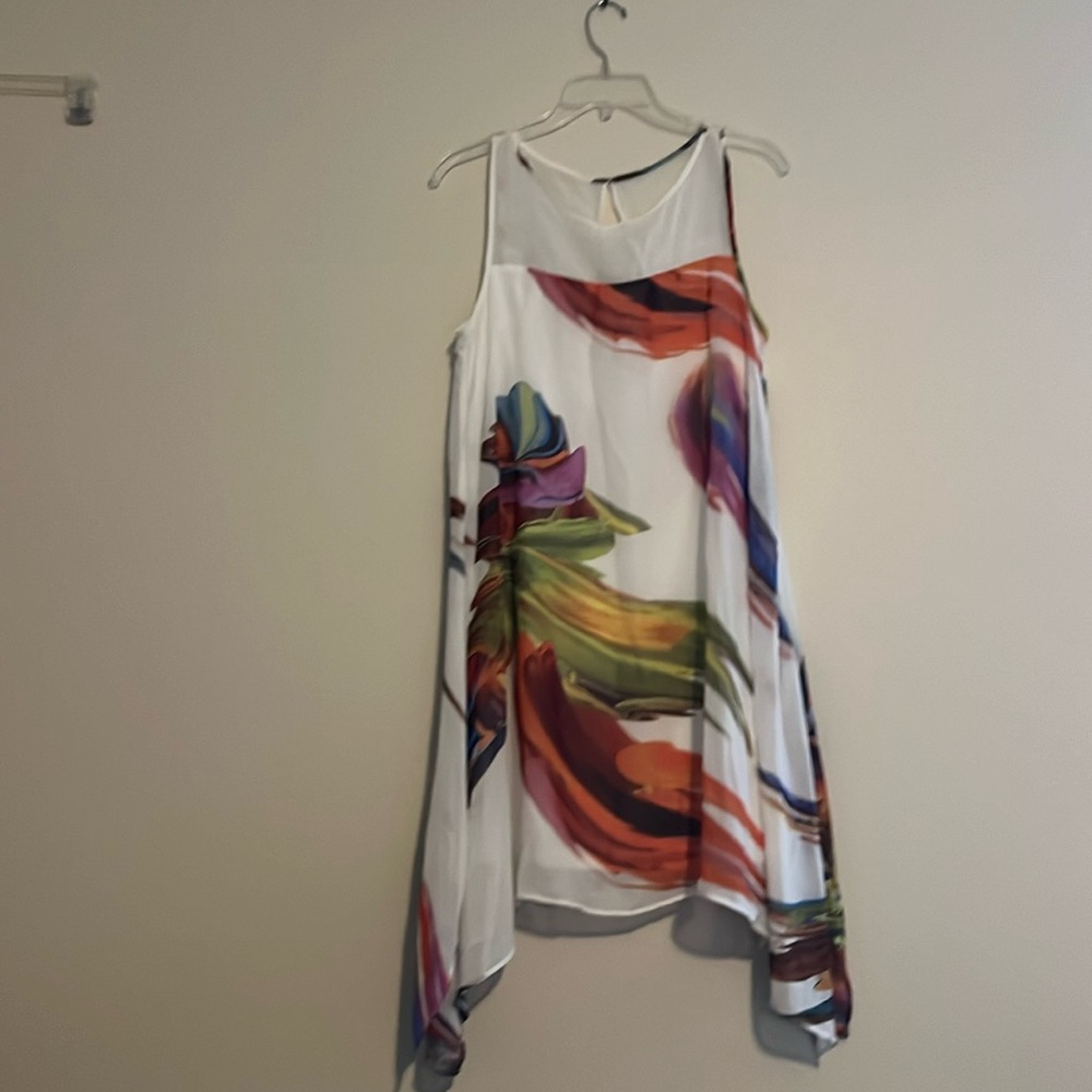This size 10P dress is in great condition. It is a mix of springy summer colors.